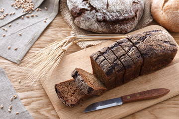 Sliced black bread on a wooden table