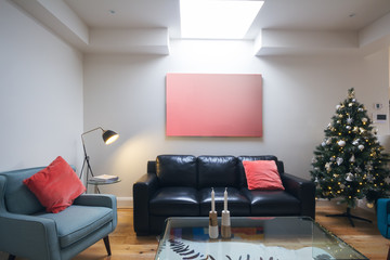 Three seater sofa in living room with christmas tree