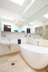 Master bathroom clean white with large bathtub in luxury home