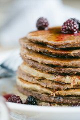Whole wheat oatmeal pancakes with blackberry and syrup
