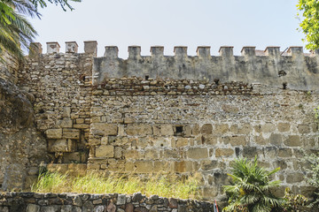 wall and tower of medieval castle in Marbella Andalucia Spain