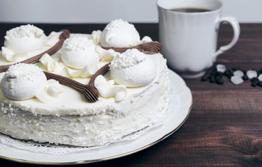 Meringue cake and a cup of coffee