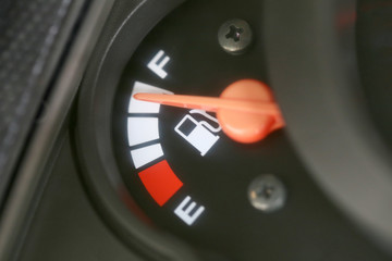 Naklejka premium Fuel gauge with warning indicating quantity fuel tank.