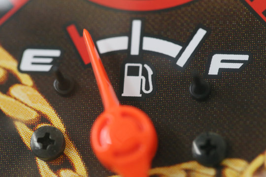 Fuel Gauge With Warning Indicating Low Fuel Tank.