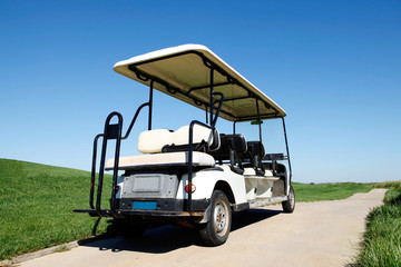 White golf carts at the green golf course