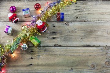 Christmas background with decorations and  light on dark wood ba