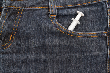 Sapric in the front pocket of jeans.  background.