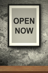 OPEN NOW quote on the photo frame concreate background