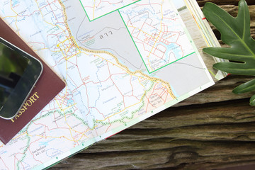 Fototapeta na wymiar travel concept, Preparation for travel, passport, road map on wooden table