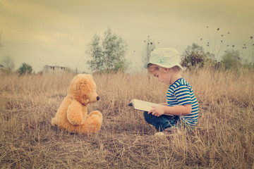 Cute girl reading book Teddy bear - 97004532