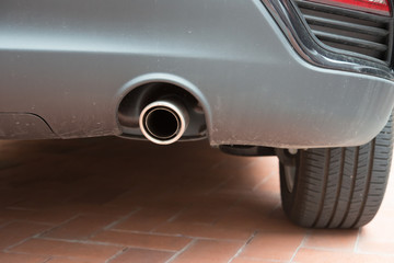 exhaust pipe of a silver car