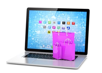 laptop and  shopping pags on white background