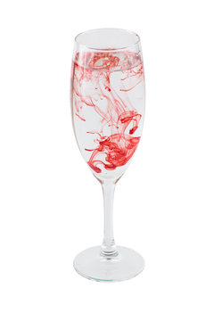 Full wineglass with red stains isolated on a white background