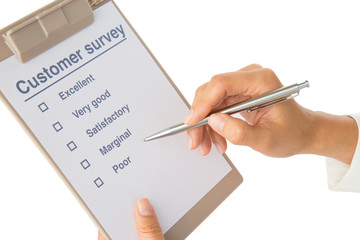 Hand fills out customer survey