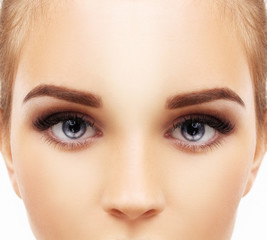 Naklejka premium Woman blue eye with makeup and long eyelashes