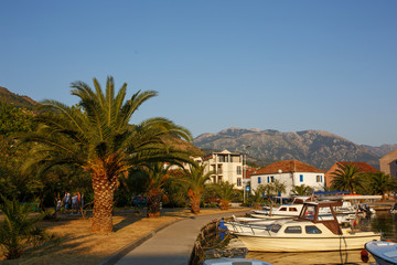 Boats and yachts in the harbor, beautiful summer landscape. Tivat marina, Montenegro.