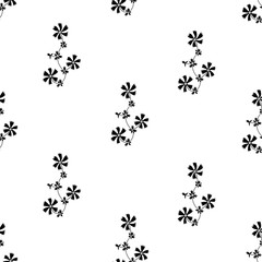 Fototapeta na wymiar Ornate seamless pattern with small black flowers on white background.