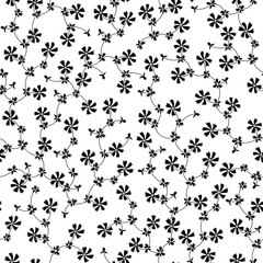 Ornate seamless pattern with small black flowers on white background.