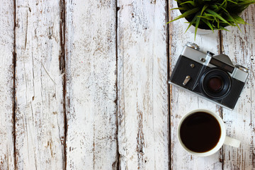 top view image of cup of coffee and old camera