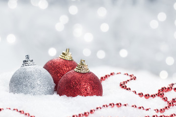 Christmas balls on snow