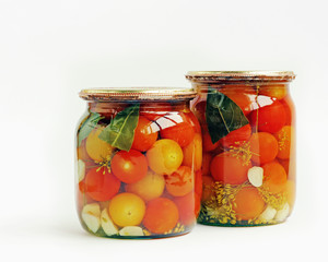 The cherry tomatoes preserved in glass jars