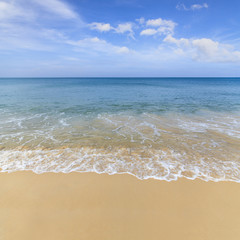 Fototapeta na wymiar Sand beach and blue ocean