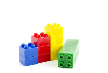 colored plastic building blocks isolated on white background