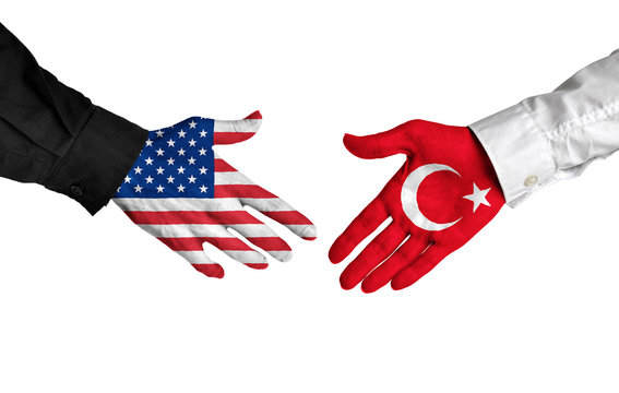 United States and Turkey leaders shaking hands on a deal agreement