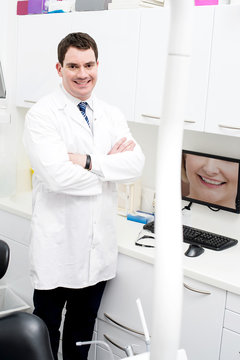 Middle aged male doctor in his clinic