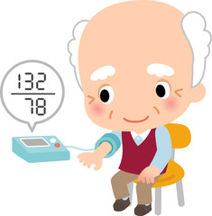 血圧計で血圧を測るシニア男性