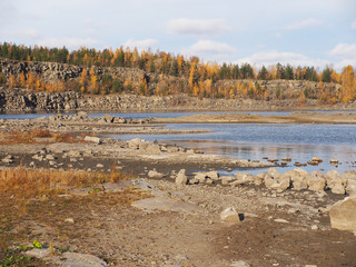 flooded quarry in autumn