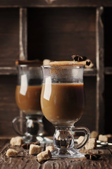 Hot american coffee with cinnamon on the vintage table