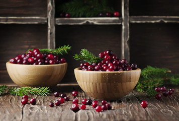 Fresh red cranberry on the vintage table