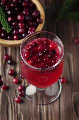 Fresh red cranberry juice on the vintage table