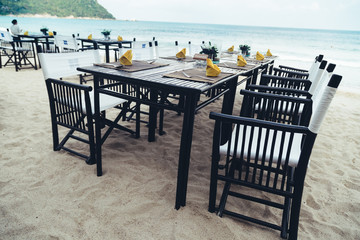 Served table at the sea shore on tropical beach