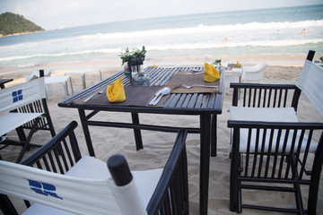 Served table at the sea shore on tropical beach