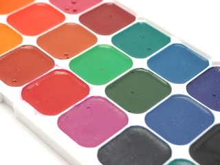 watercolor paints on a white background