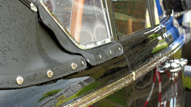 Outside look of the old willyes 4x4 jeep. The shiny black cloth covering the car