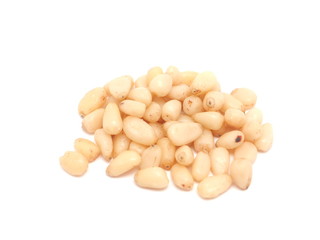Peeled pine nuts on a white background