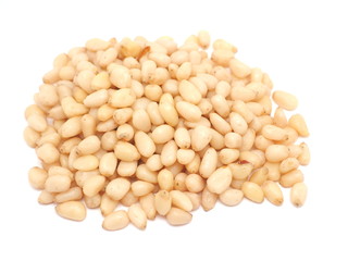 Peeled pine nuts on a white background
