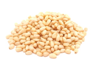Peeled pine nuts on a white background
