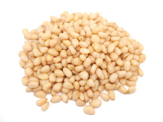 Peeled pine nuts on a white background