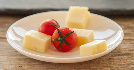 Italian cheese with tomato and garlic close up