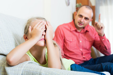 Dad giving instructions to child