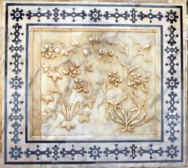 Ancient carved flower on marble in Amber Fort, Jaipur, Rajasthan