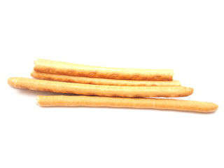 sweet flour straws on a white background