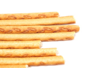 sweet flour straws on a white background