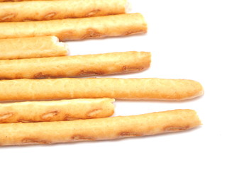 sweet flour straws on a white background