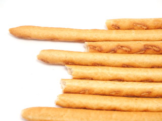 sweet flour straws on a white background