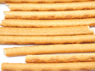 sweet flour straws on a white background